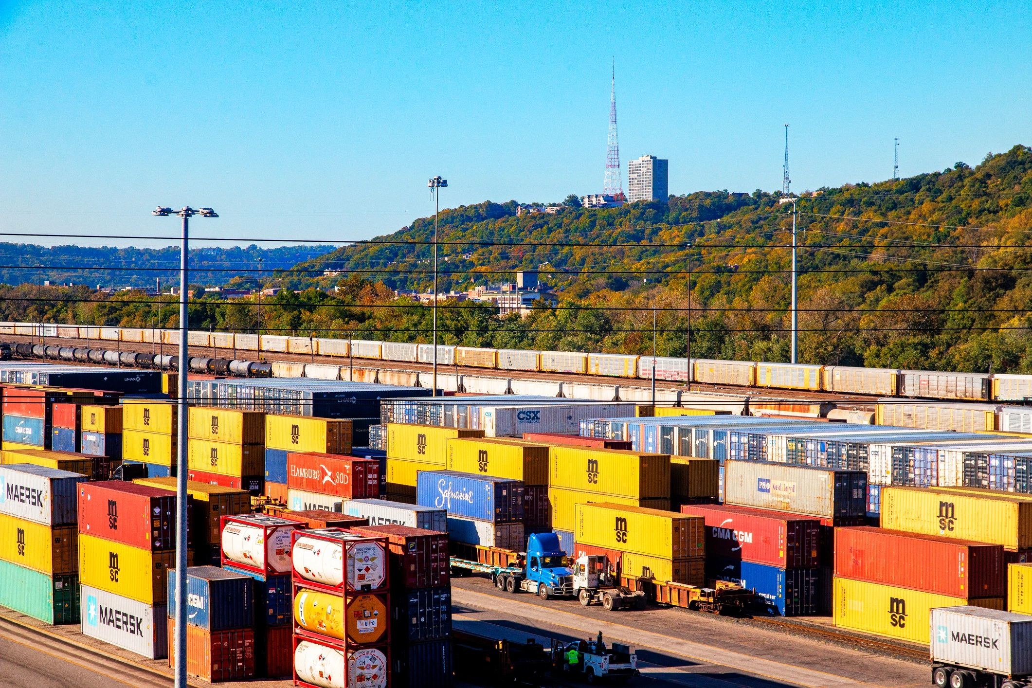 Cargo containers at a logistics yard representing international sourcing and trade