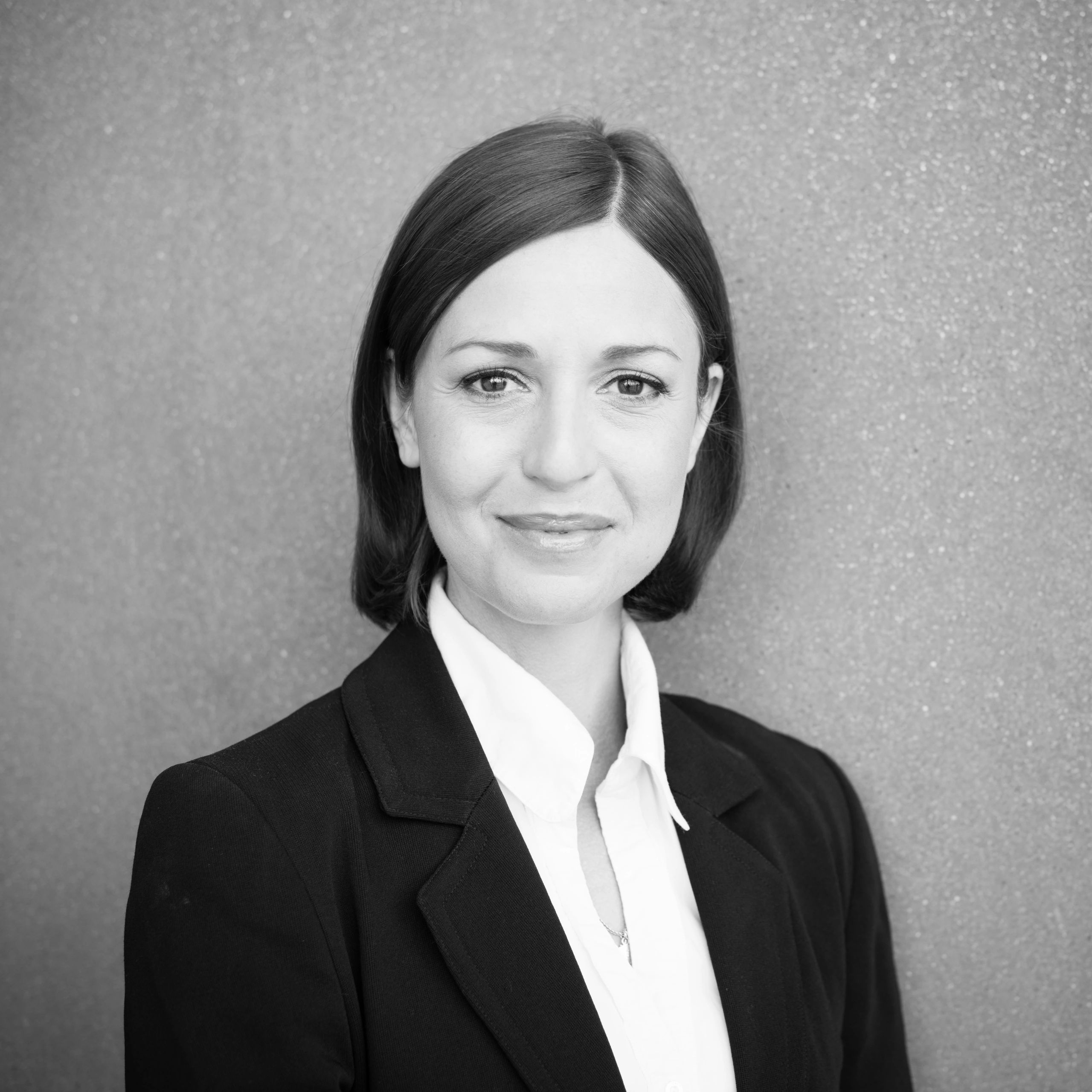 Professional portrait representing client relations leadership